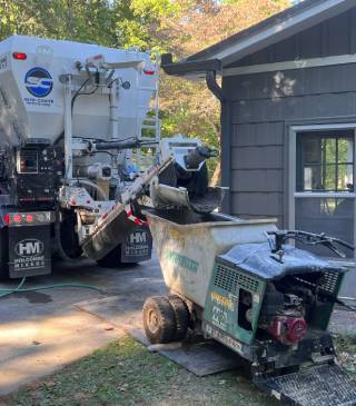 Image of Site-Crete mixing concrete right on site on a residential job.